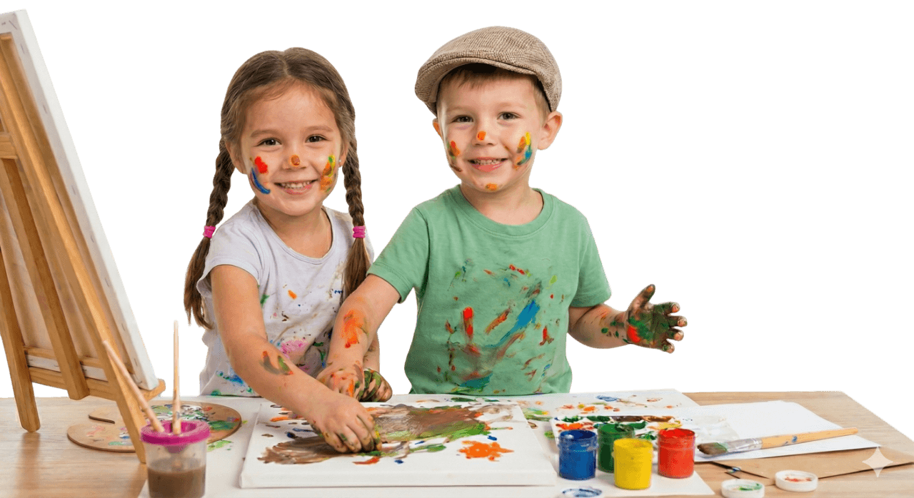 Two happy children smiling while finger painting together at ExcelPath therapy center in Eagan, Minnesota